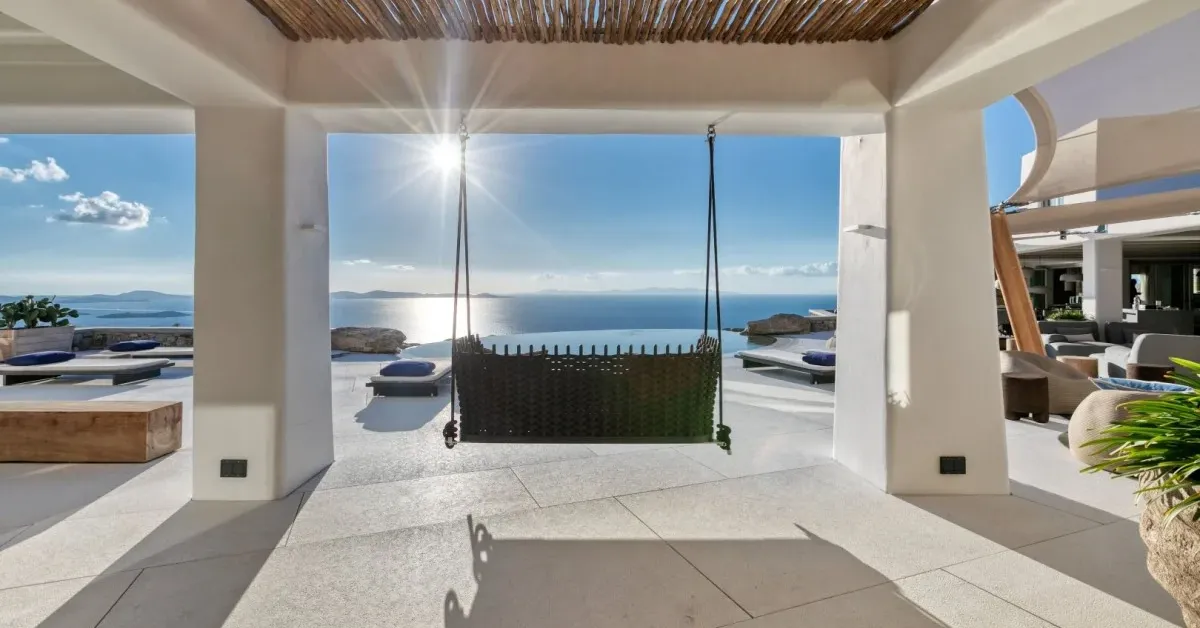 A secluded luxury villa overlooking the Aegean Sea in Mykonos, representing privacy-focused ultra-luxury travel