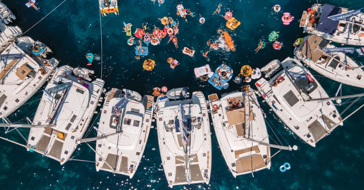 Fleet of superyachts cruising between Mykonos and Paros during exclusive themed event Fleet of superyachts cruising between Mykonos and Paros during exclusive themed event