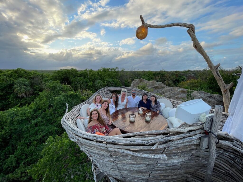 Printed photo of bag being tossed into the sky on top of grass.